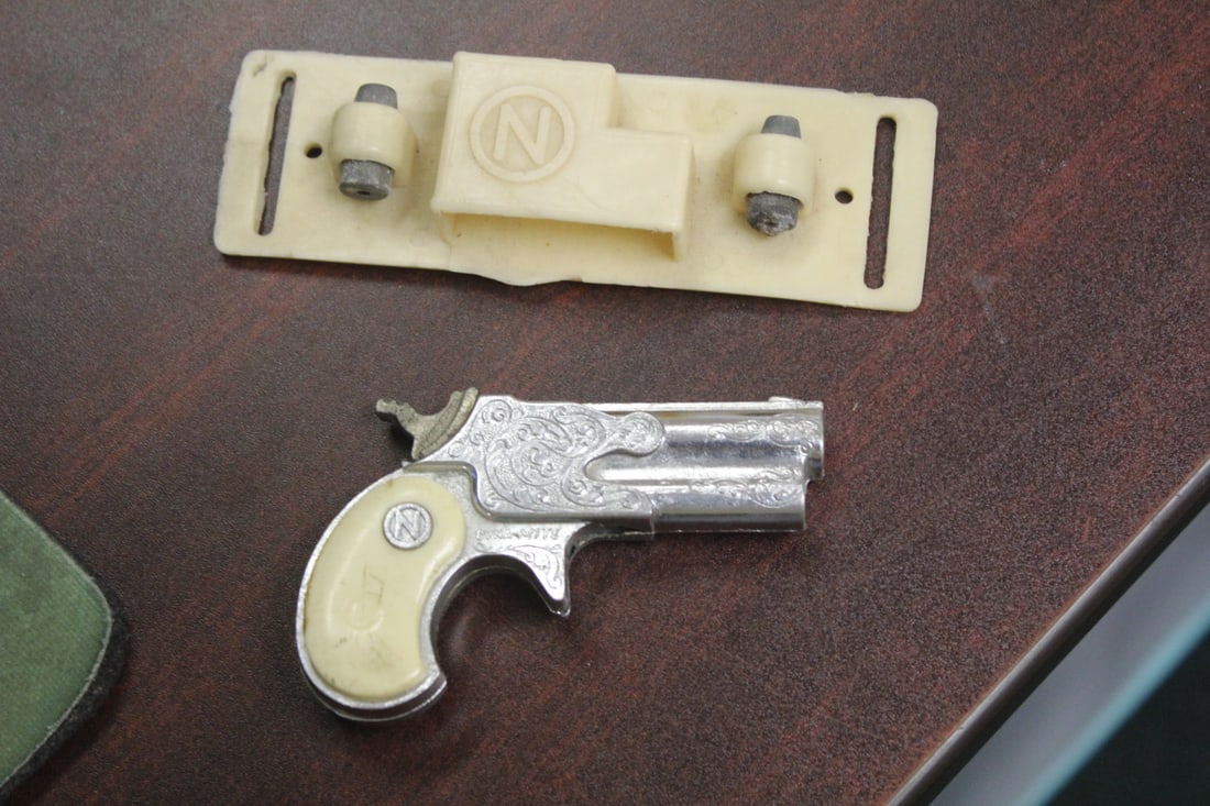 Vintage Nichols Toy Gun: Dyna-Mite toy cap gun with bullet belt holster