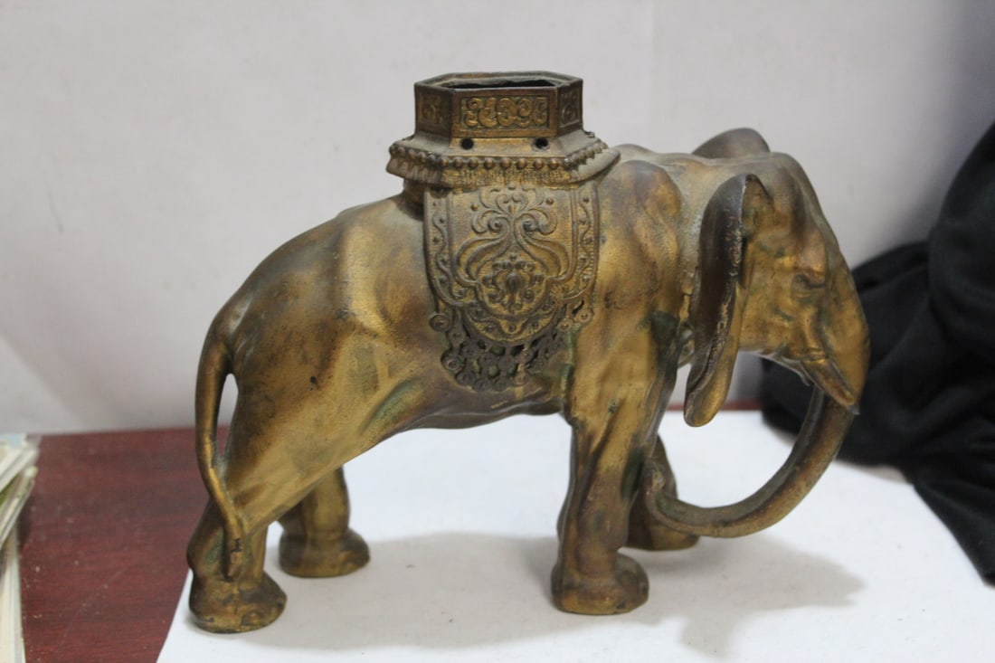 A Metal Elephant: most likely missing the rider or a lid - 7 1/2" across