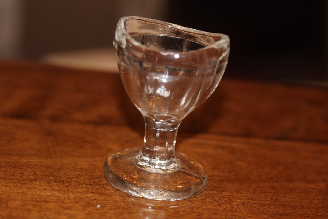 Glass egg cup: 2 1/2 inches tall