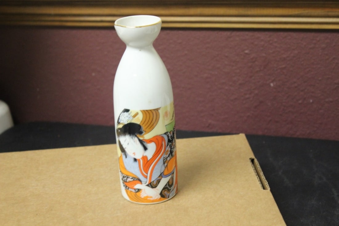 A Saki Bottle: 7" tall