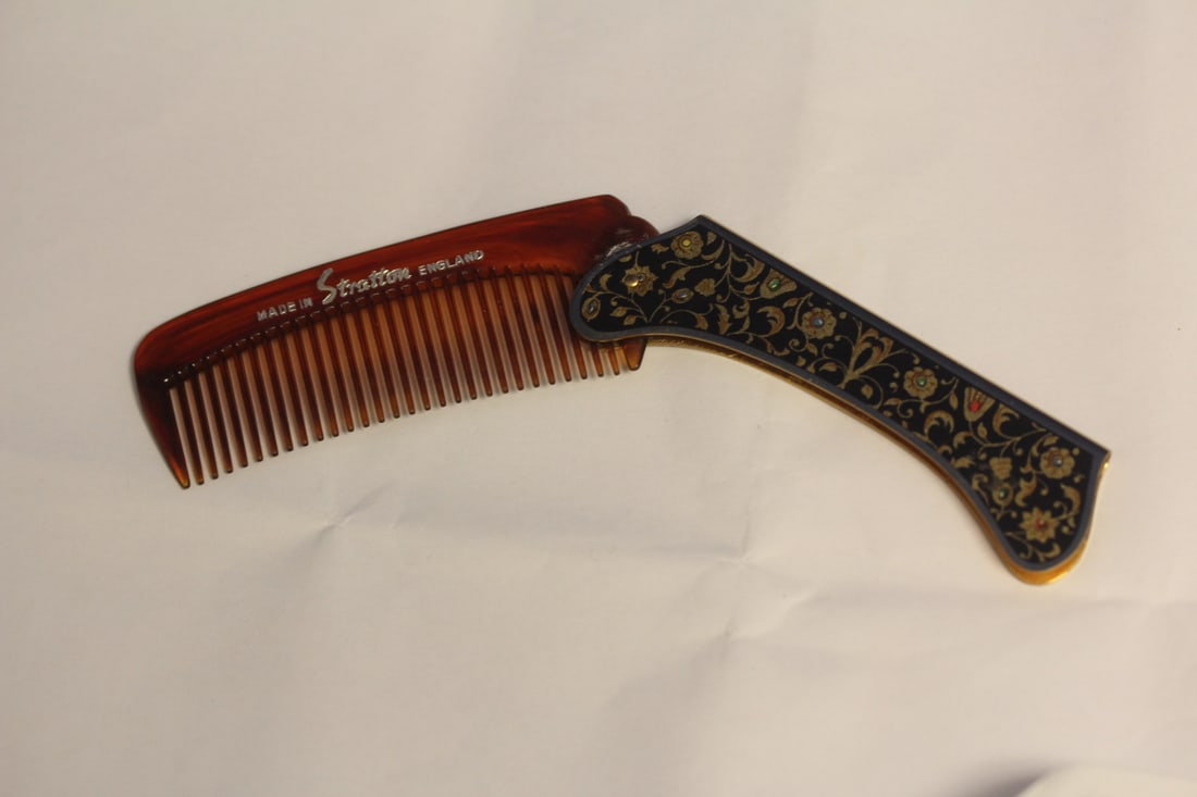 A Stratton Enamel and Lucite Comb: as shown
