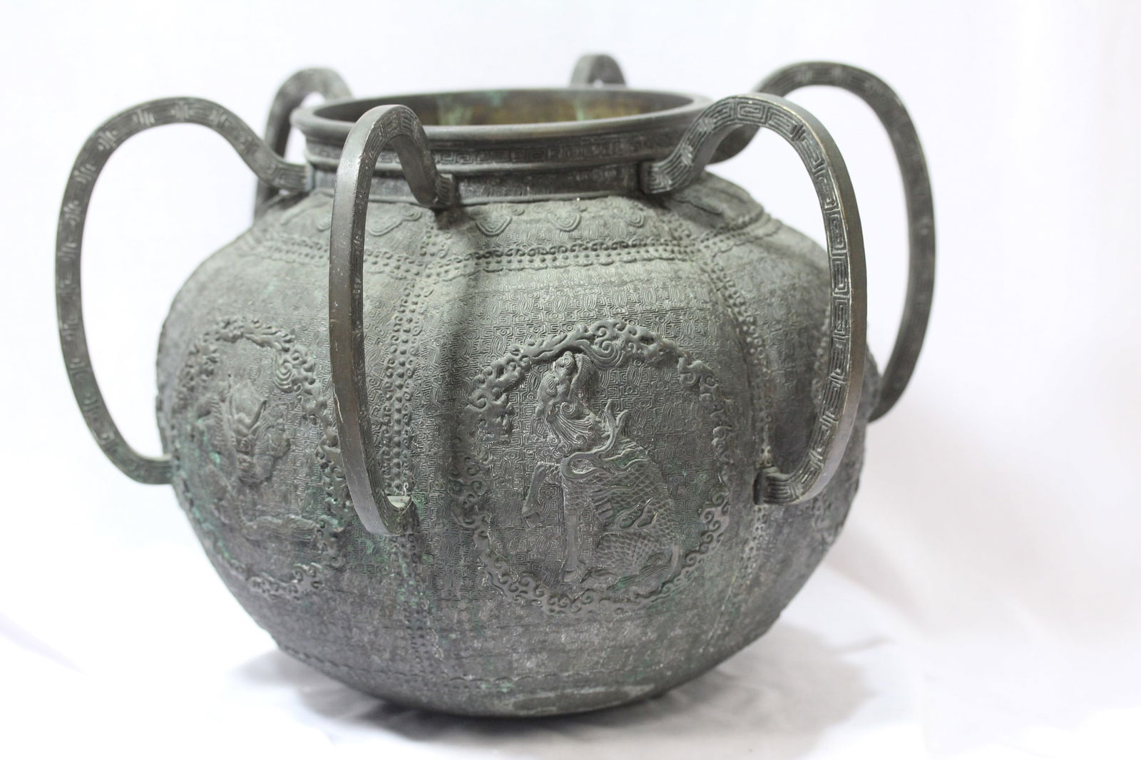 A Chinese Bronze Jar: Looks to be old - with 6 handles - 9 1/4" tall - please note: payment via wiretransfer only - please note: one handle is loose