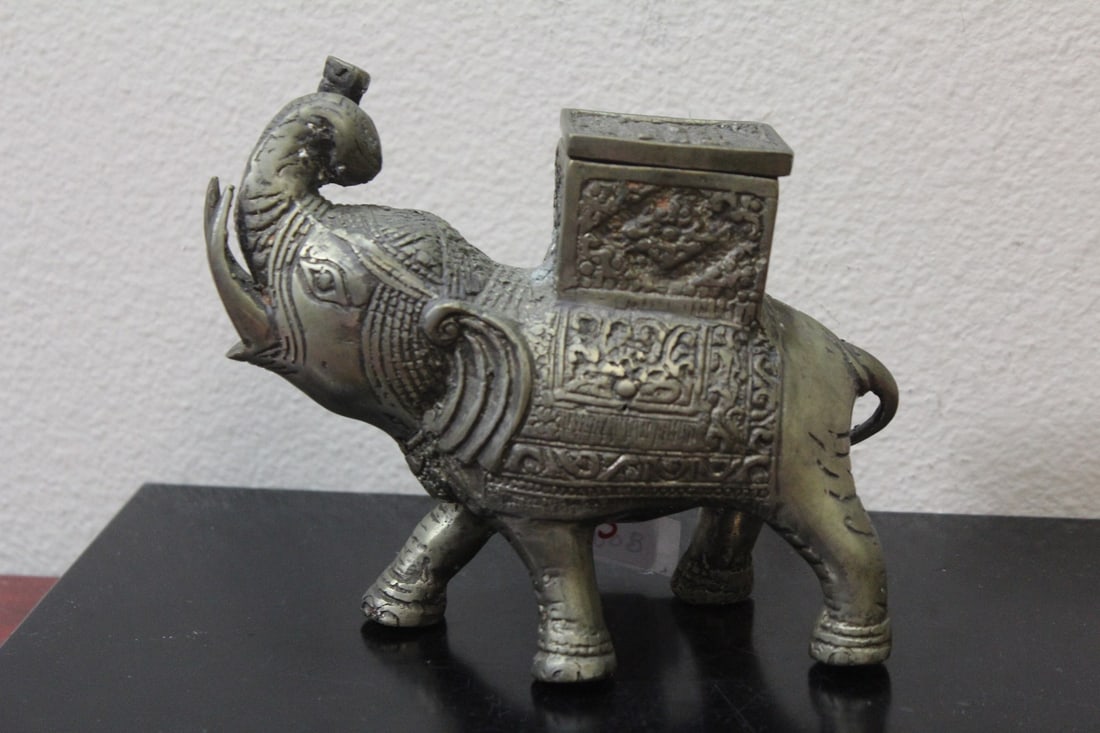 A Metal Elephant: 6 1/4" long - either brass, bronze or other metal - possibly old - the whole thing is a box