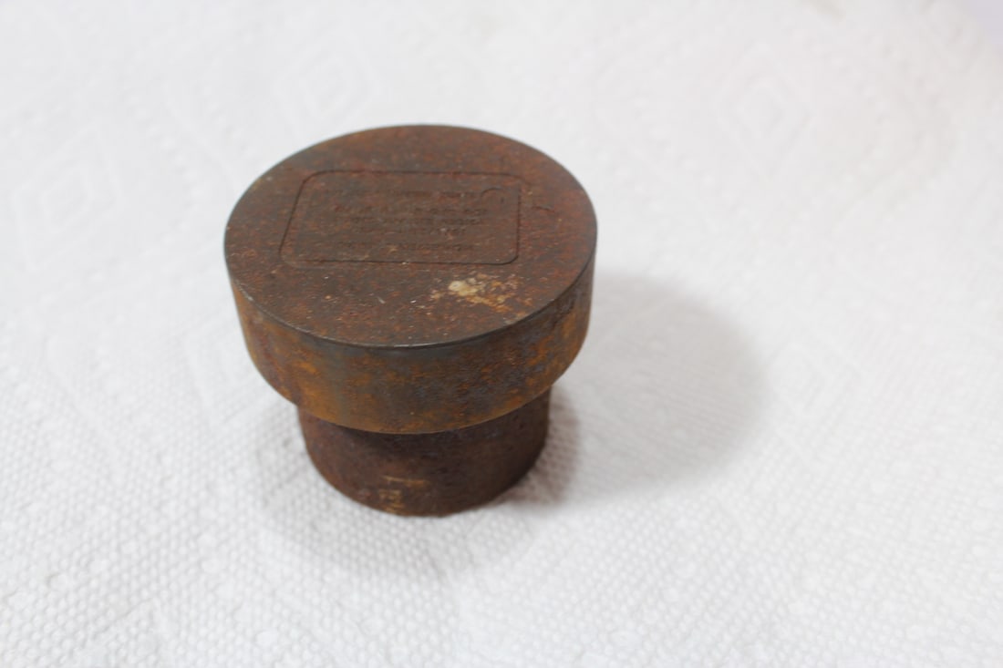 A Heavy Cast Iron Stamp of Weight: 2 1/2" in diameter