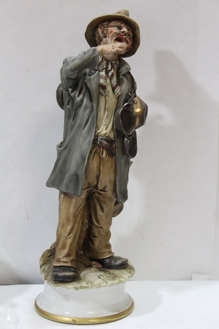 A Capodimonte Hobo Figurine: please note: breaks as shown - as found - 13 inches tall