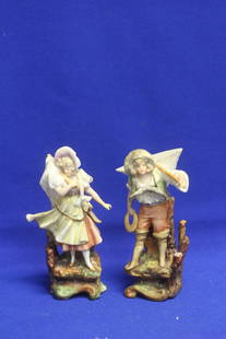 A Pair of Ceramic Figurines: please note: minor losses as shown - 5 inches tall