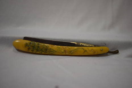 A Bakelite Handle Razor: 6" long