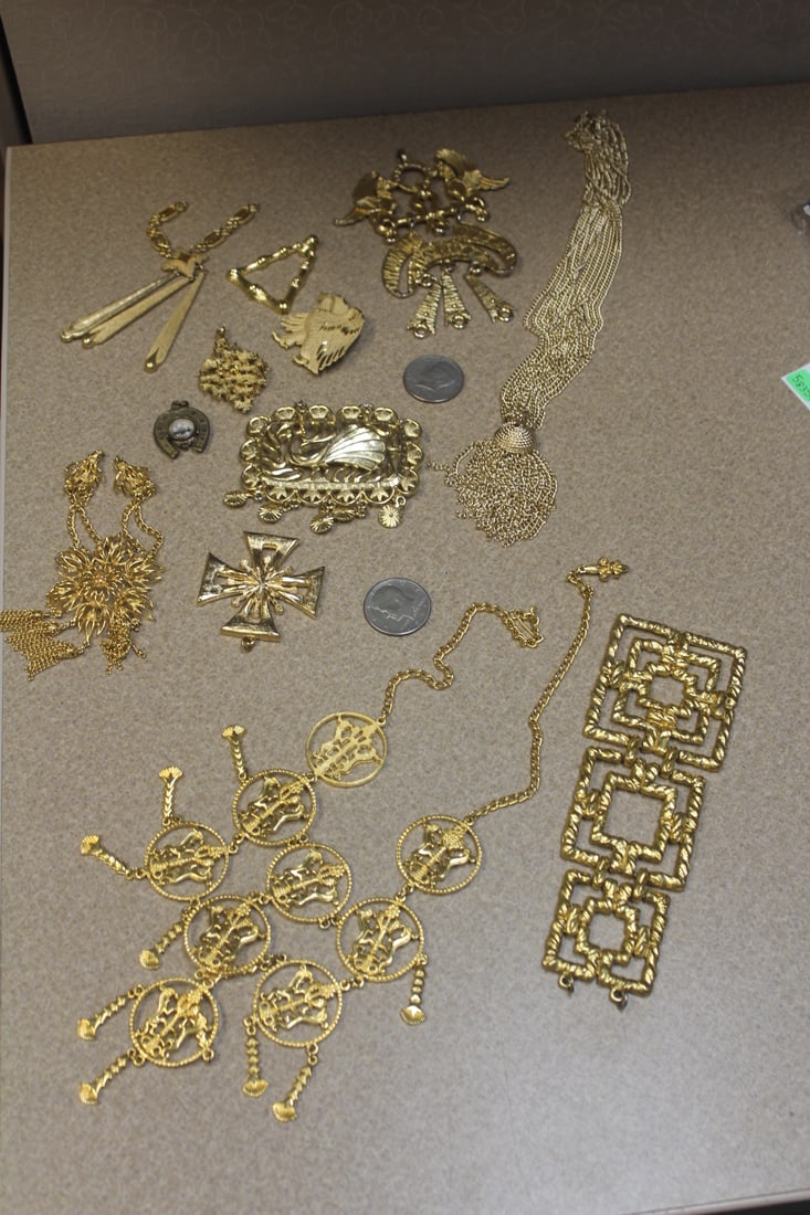 Lot of gold jewelry: gold plated/gold toned, mostly large ones to include: Trifari, monet others, mostly unsigned, coins not included with lot, total 12 pieces