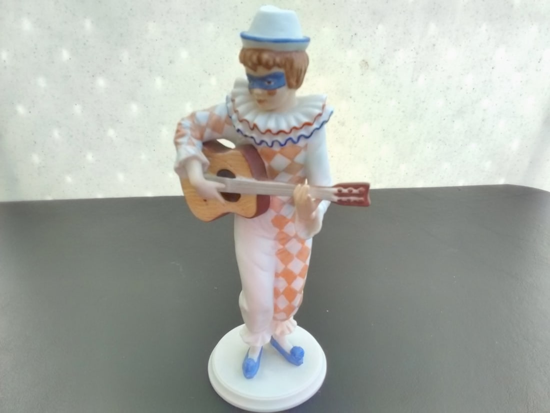 A Kaiser Polychrome Bisque Harlequin Figurine: bisque porcelain figurine with guitar - Limited edition - 7 1/4 inches tall