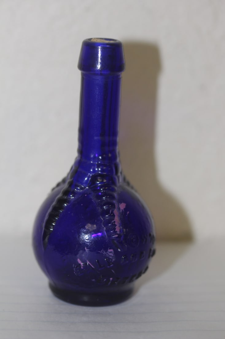 Ball and Claw Cobalt Blue Glass Bottle: vintage - small= 3" tall