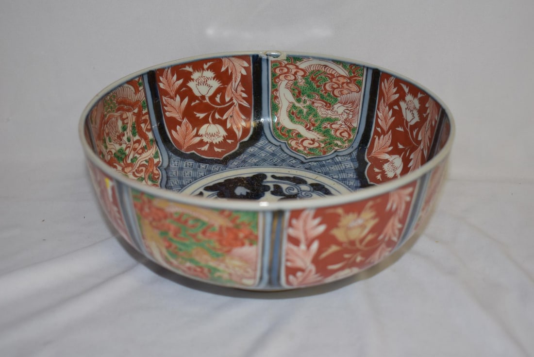 A Japanese Antique Imari Bowl: 19th century - please note: one small blemish as shown, possibly a manufacturer's defect - 8 1/2" in diameter