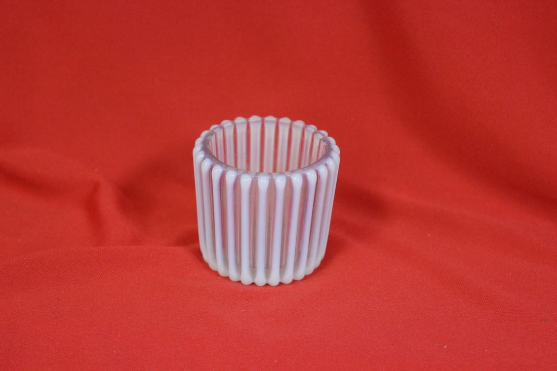 An Iridescent? Glass Toothpick Holder: 2" tall - please note: inside chip between columns