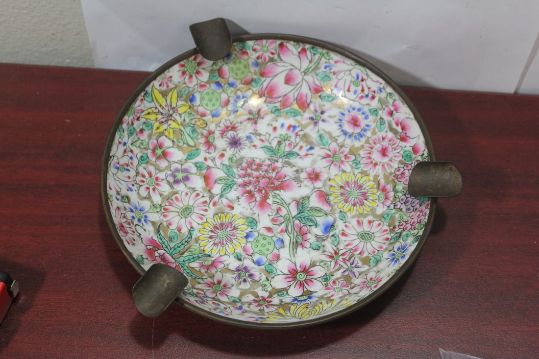 A Brass and Porcelain Bowl made into an Ashtray: vintage - decorated in Hong Kong - diameter of the porcelain= 7 3/4"