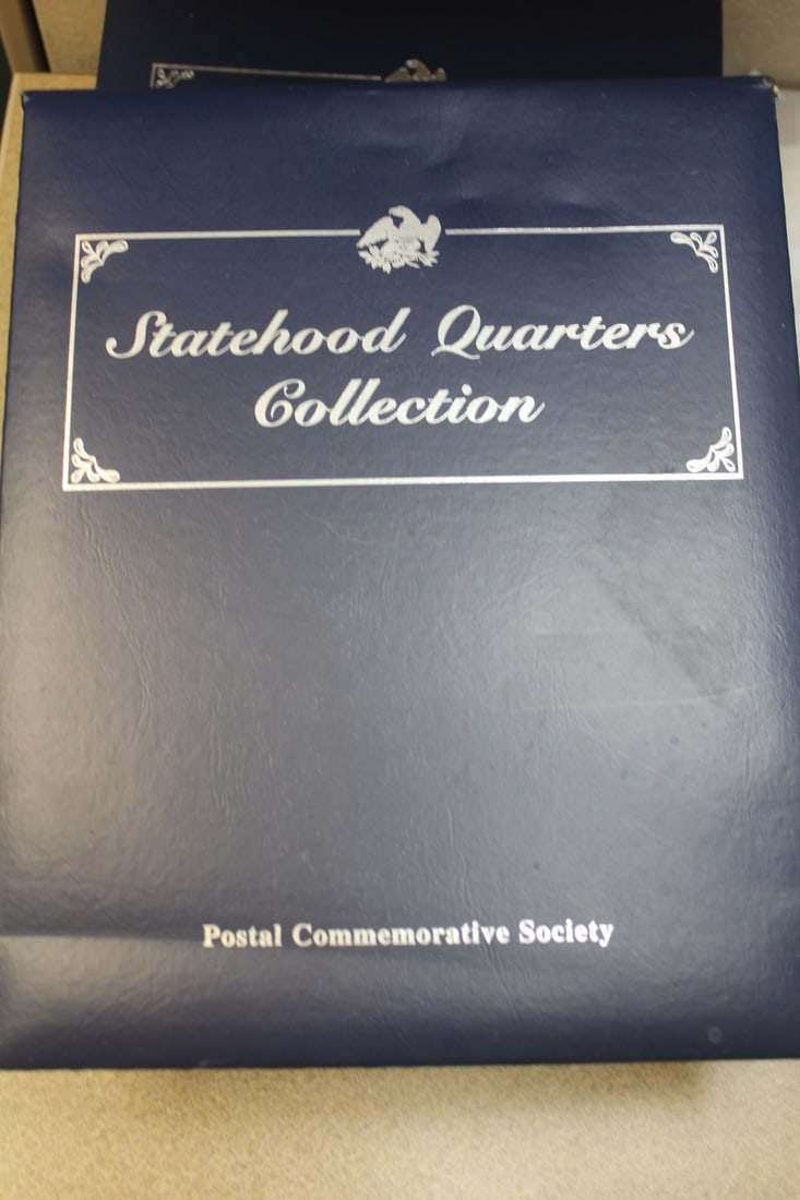 Statehood Quarter Collection: total of 64 quarters - inside a binder