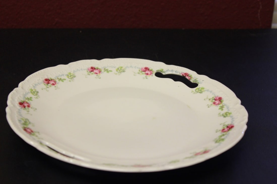 An Antique/Vintage Porcelain Dinner Plate: With Handles - Made in Germany - Marked on the bottom - 9 1/2 inches in diameter