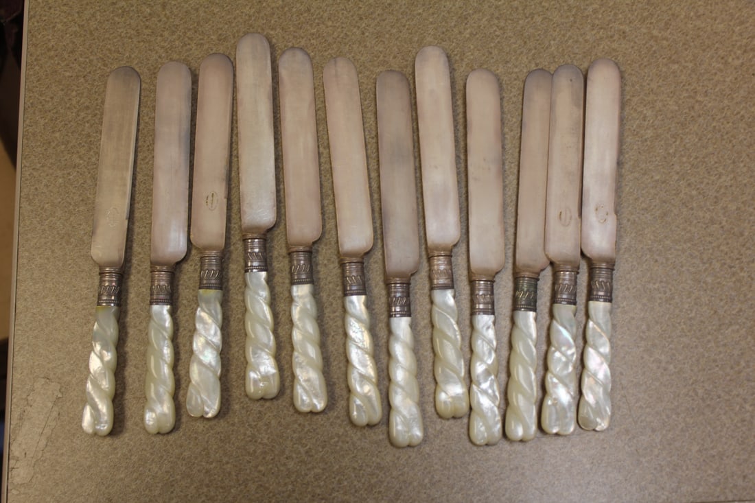 Sheffield Mother of Pearl and Sterling Band Knives: twisted design - set of 12 - 7 3/8" long each