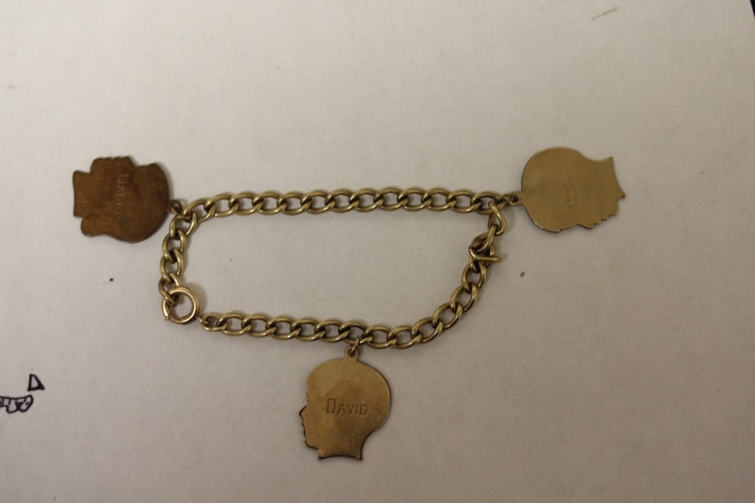 A Gold Filled Charm Bracelet: Marked GF