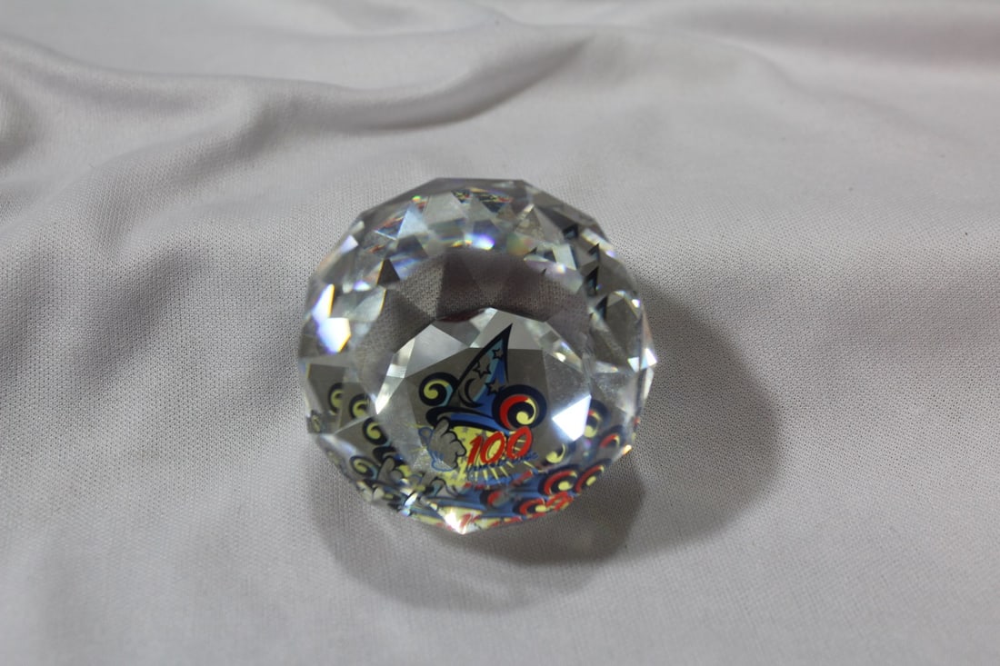 A Swarowski - Disney Golf Ball Crystal Paperweight: 1 3/4" in diameter - Disney 100 - rare
