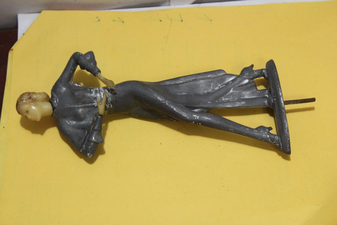 An Art Deco Metal and Plastic Lady: please note= needs base - 7 7/8" tall without the nail