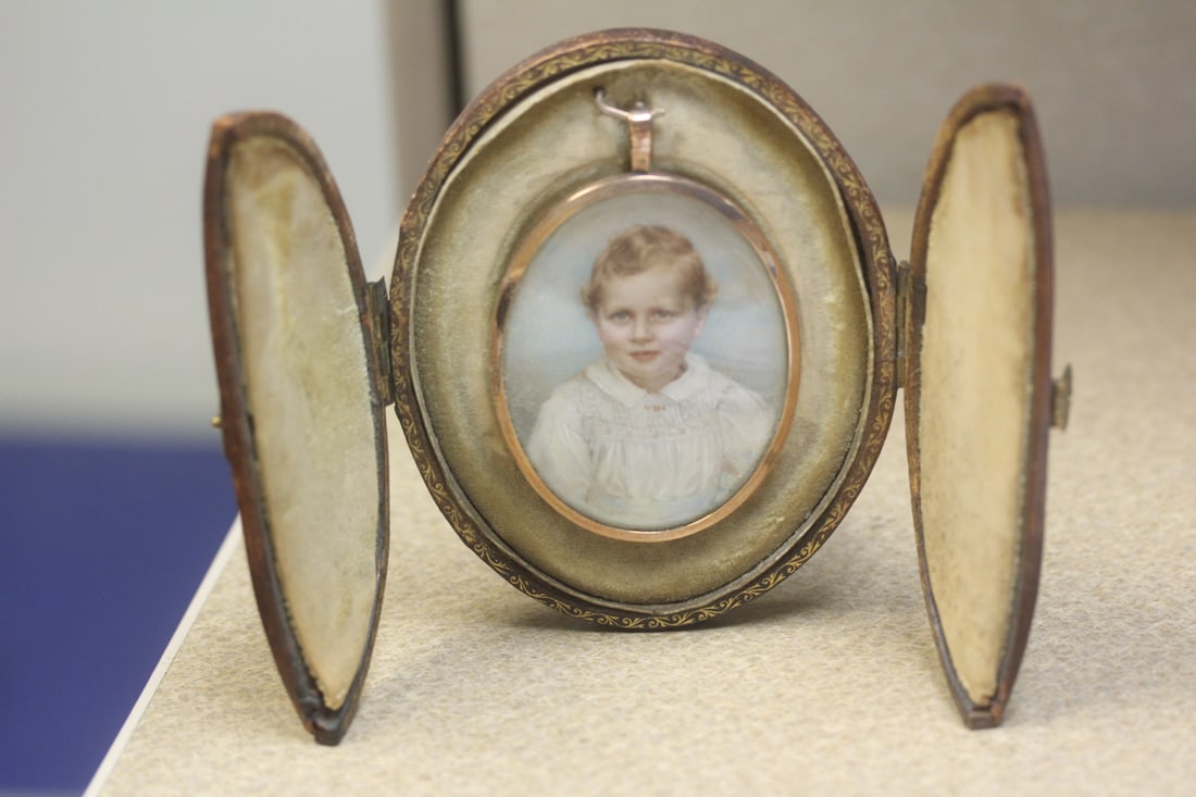 Antique Oval Leather Picture Frame: with hand coloured photograph - 4 1/4" in length