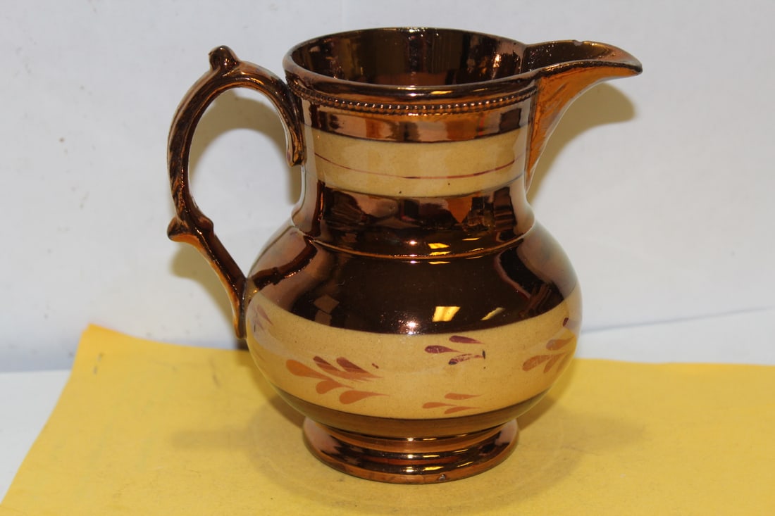 A Ceramic Lusterware Pitcher: please note: tiny chip or fleabite on spout as shown - 5 inches tall