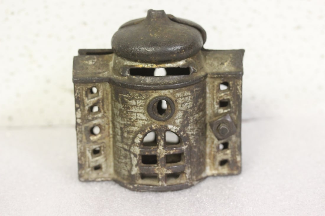 An Old Cast Iron Coin Bank: 3 1/2" tall