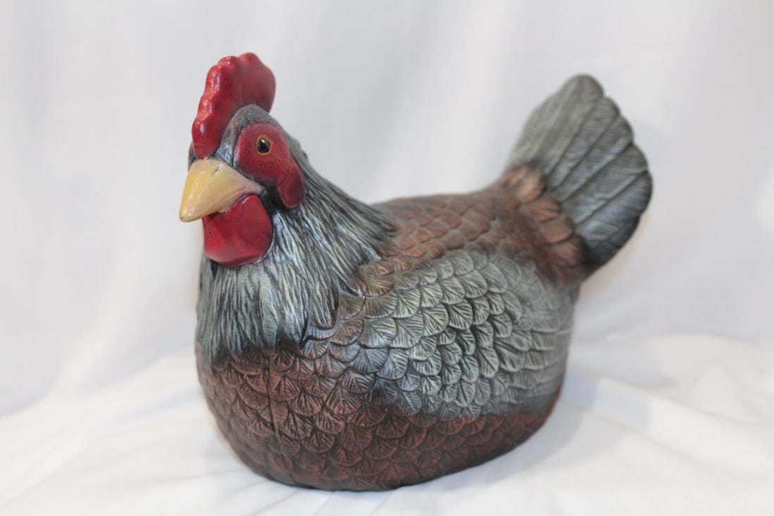 A Ceramic Chicken: 8" across - please note a colorized chip as shown on photos