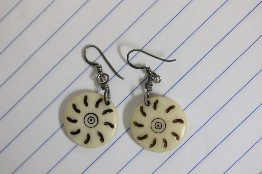 A Pair of Sterling and Bone Earrings: as shown