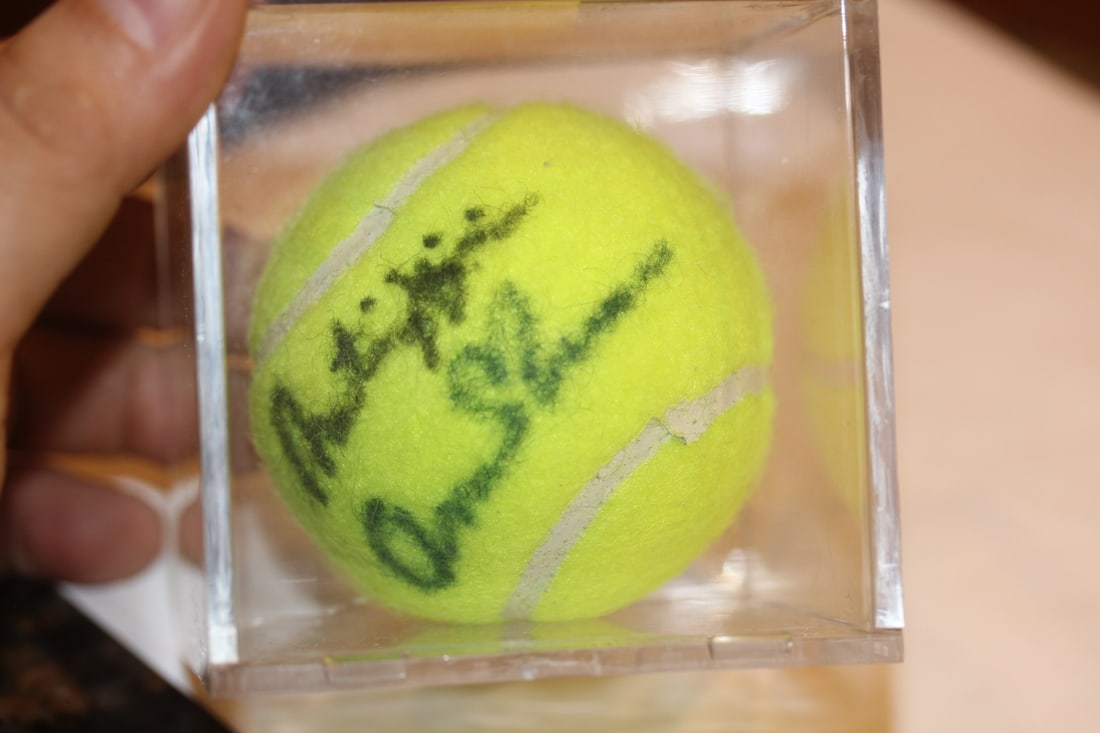 Martina Hingis Signed Tennis Ball: inside a lucite cube