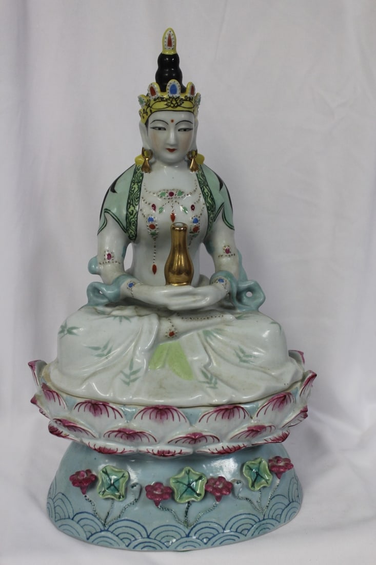 A Chinese Kwan Yin on a Lotus Pedestal: Ceramic - please note: one lotus chip as shown - overall 14" tall