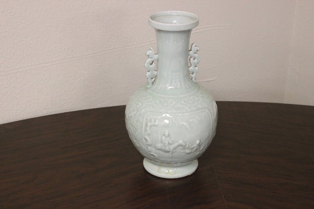 An Antique Chinese Celadon Vase: Marked China - late 19th to early 20th century - unusual shape - drilled and small rim chip as shown - 14" tall