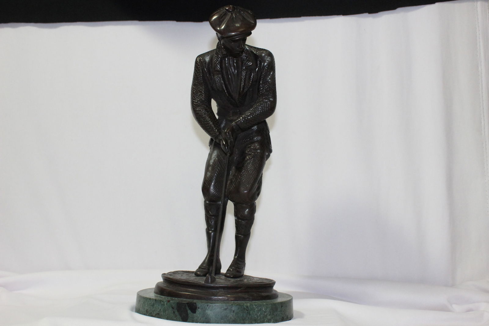 A Bronze Golfer Statue: on marble base - overall= 12 1/2" tall