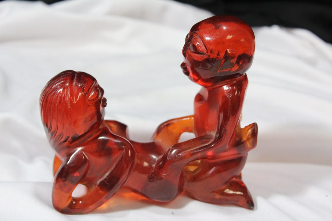 An Amber Resin Erotica Figurine: 4 1/2" x 4 1/2"