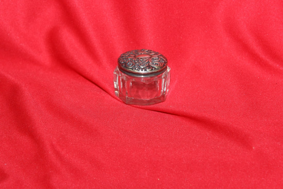 A Sterling Top Ornate Glass Container: 1 1/2" in diameter