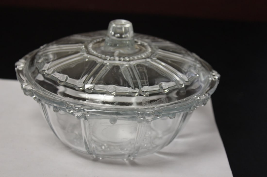 A Round Glass Candy Dish With Lid: 7 inches in diameter