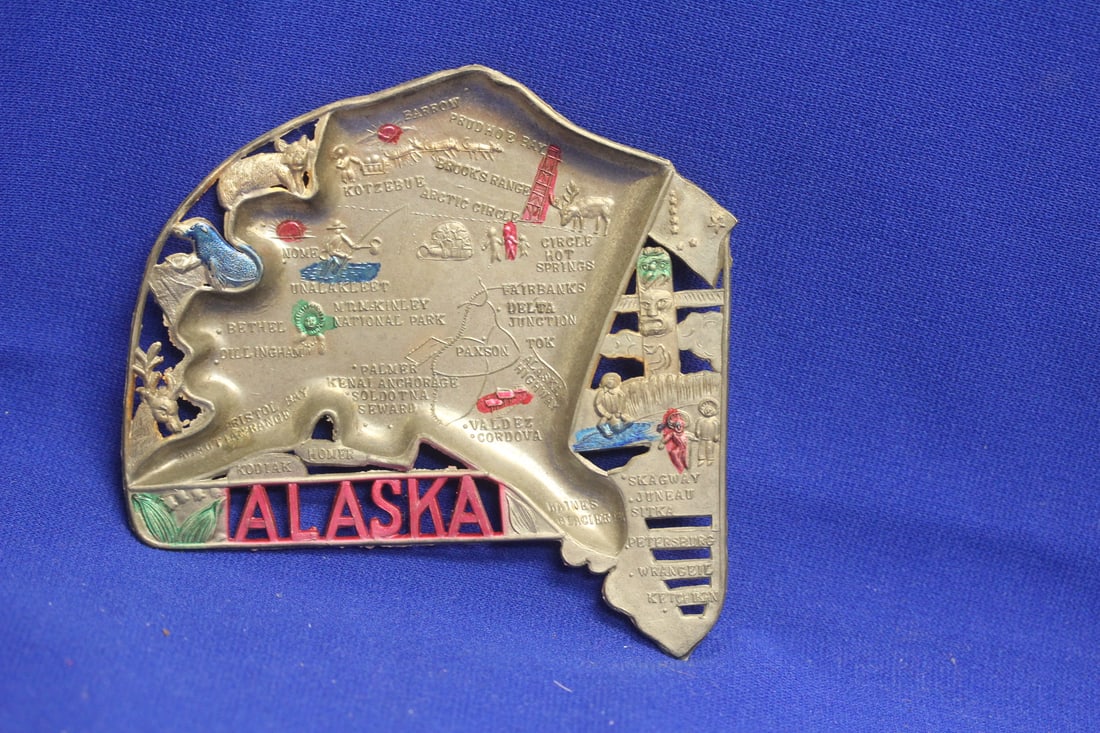 An Alaska Souvenir Metal Ashtray: as shown
