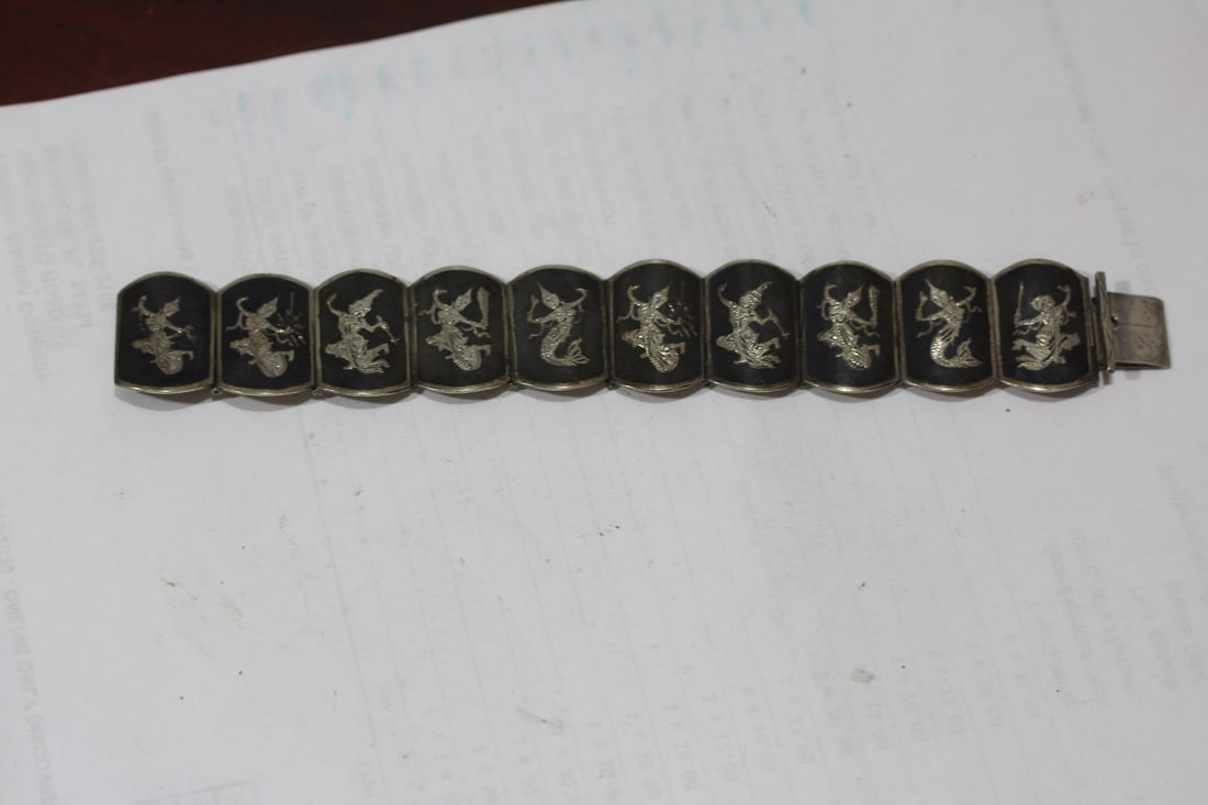 A Sterling Thai Bracelet: 7 3/4" across unclapsed