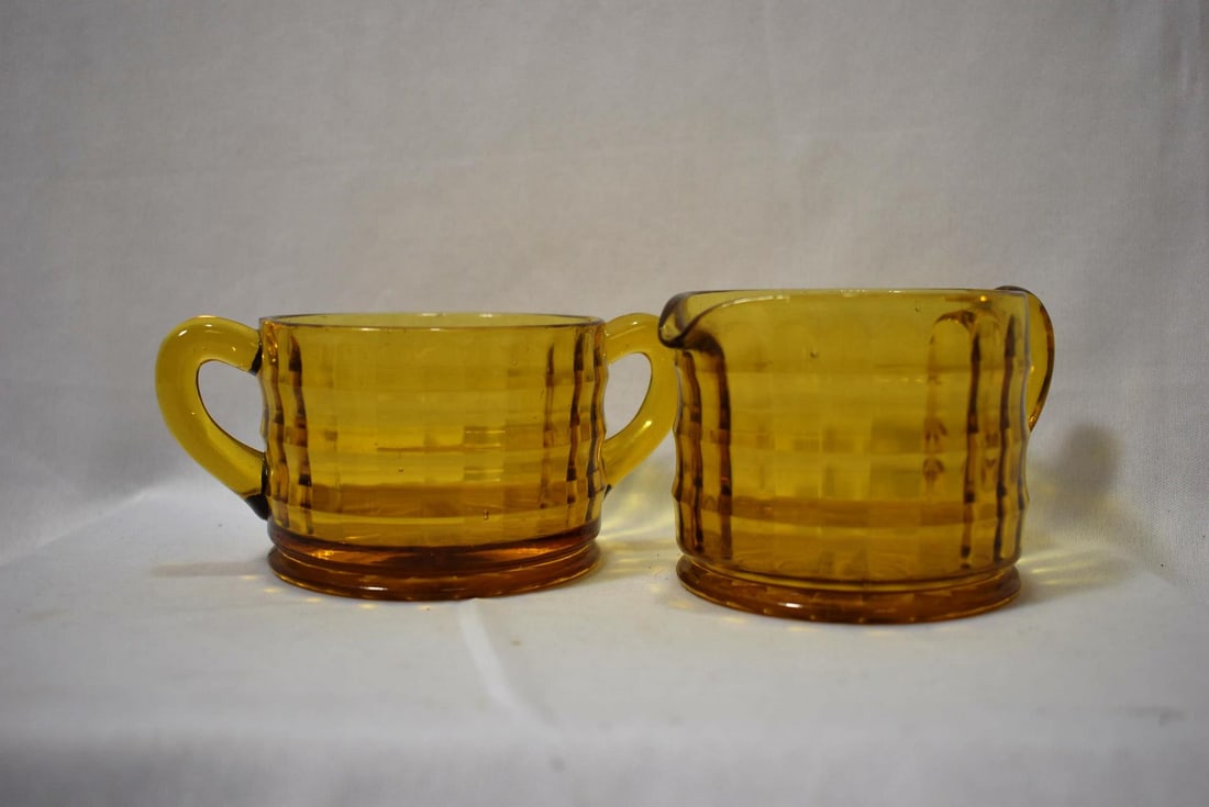 An Amber Glass Set of Cream and Sugar Container: 2 5/8" tall