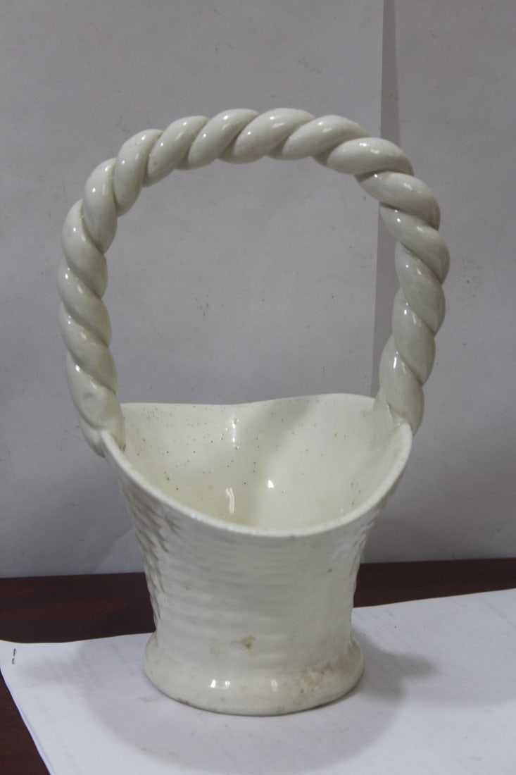A Ceramic Basket: please note: one tiny chip as shown - 9 3/8" tall