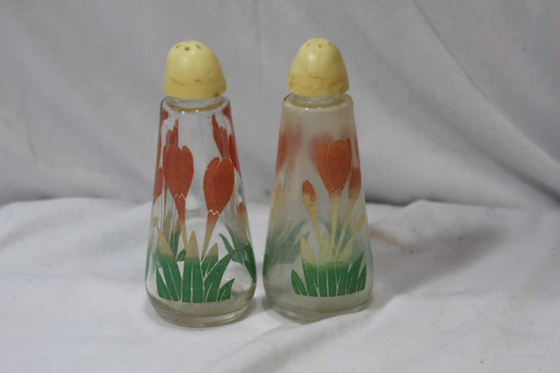 A Pair of Salt and Pepper Shakers: 4 1/4" tall