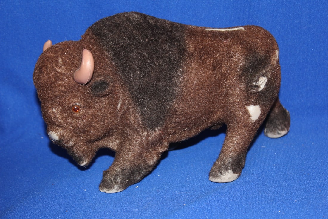 A Plastic Bisen Bank: 8 1 /4" across - worn