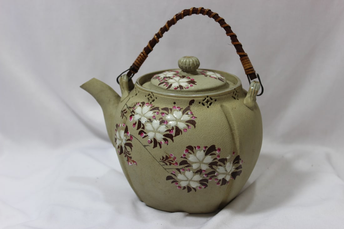 A Japanese Teapot: Marked on the bottom - 5 inches tall, not including the handle