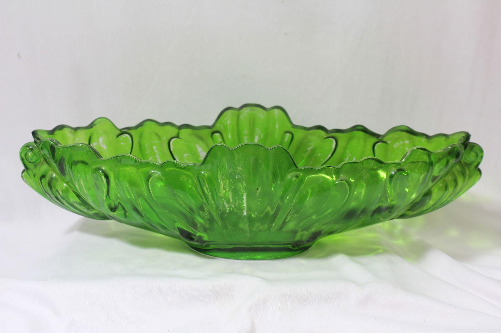 A Green Glass Fruitbowl: 15" across