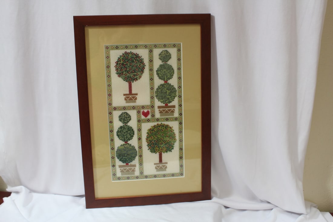 A Framed Needlepoint: 15" x 10 1/4" in overall