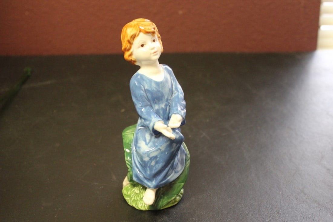 A Ceramic Figure of a Lady: Numbered on the base - 6 1/2 inches tall