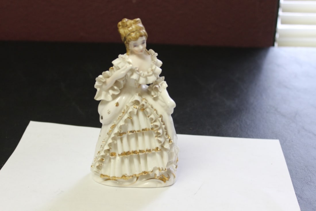 A Japanese Porcelain Figurine: 6 1/2" tall