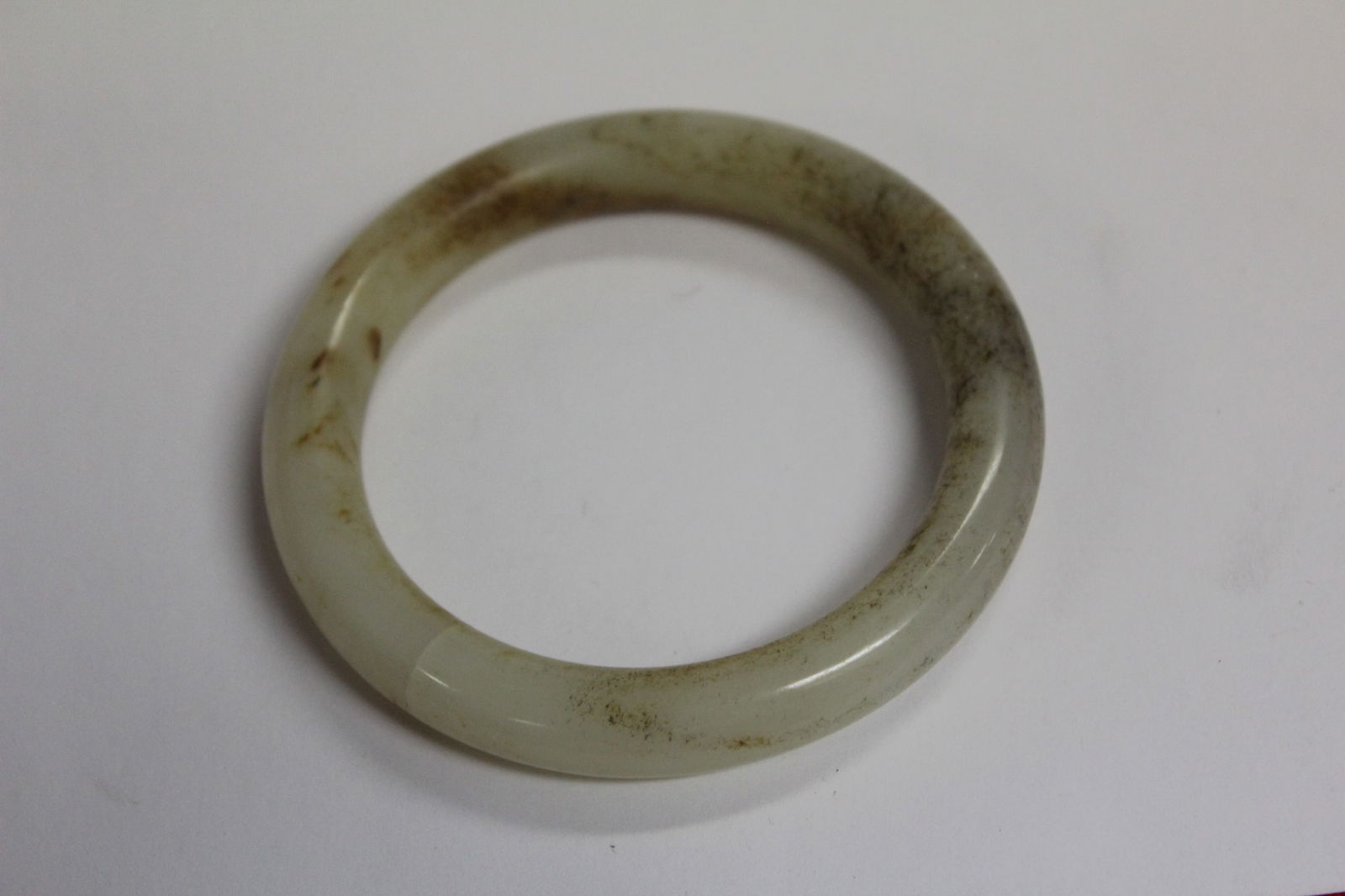 A Russet Jade Bangle Bracelet: 2 1/4" inside diameter