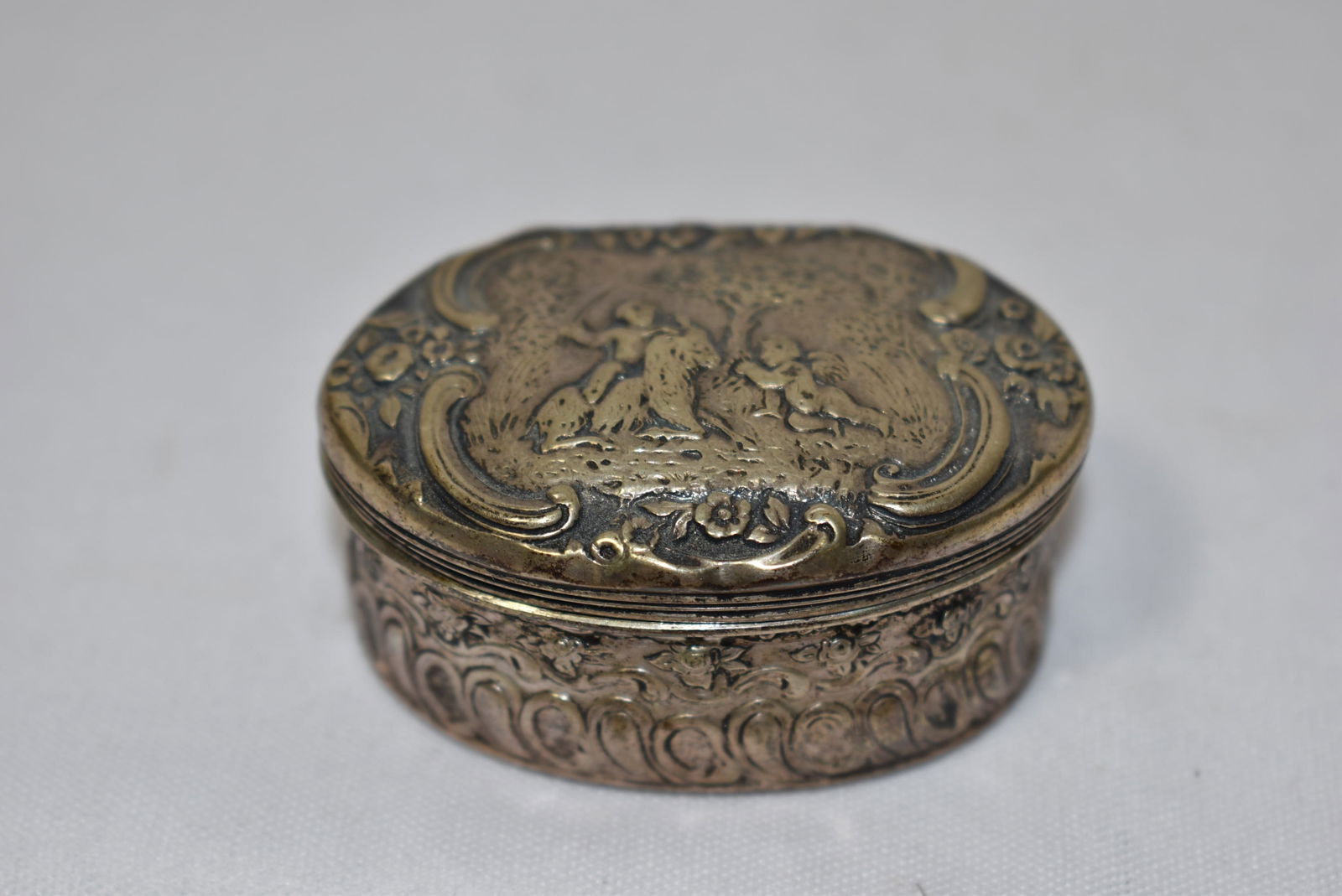 A Sterling Silver Repousse Snuff Box: Most likely from Europe. measures 2 inches wide - 19th century