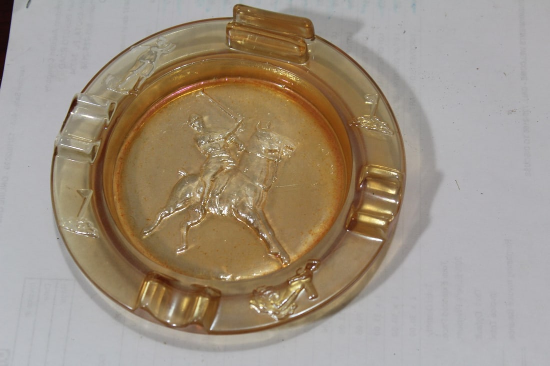 An Iridescent Glass Ashtray With Match Holder: 5 3/4" in diameter