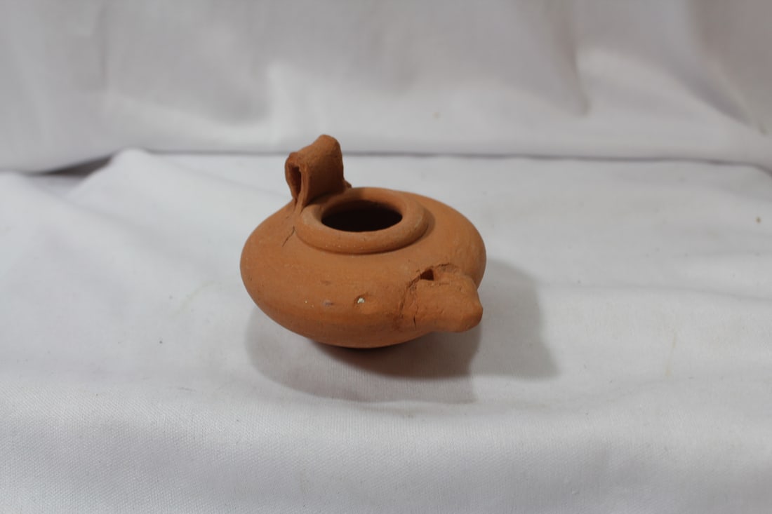 A Clay Oil Lamp: 3 1/4" across